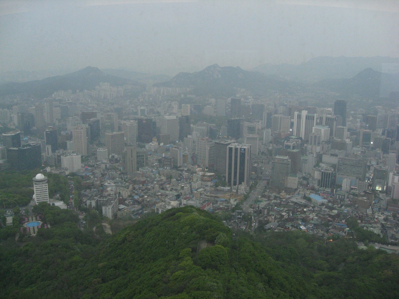 Hazy Seoul skyline viewed from N Seoul Tower during dusty conditions
