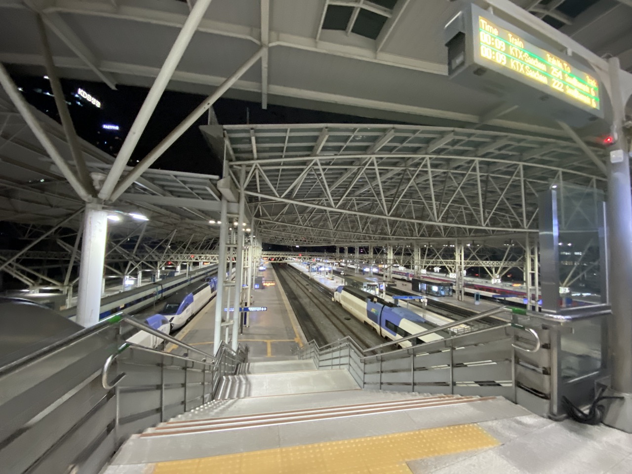 Rail tracks and platforms at Seoul Station illuminated at night